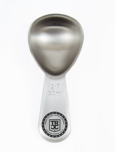 TRCC coffee scoop with the TRCC 22 stars logo engraved on handle. 